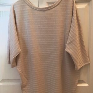 New with tags, beige size M light weight bat-winged sleeved sweater.